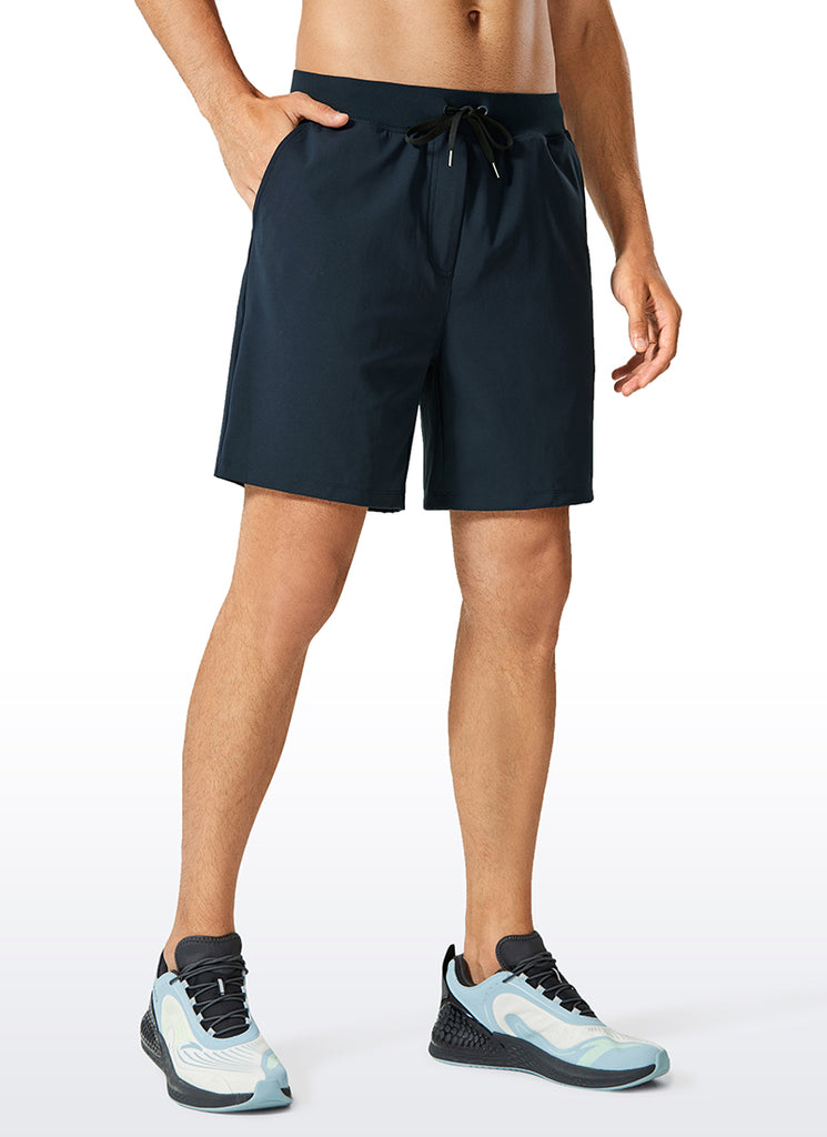 CRZ YOGA Men's Train Relaxed Fit On the Travel Linerless Shorts 7'' True Navy