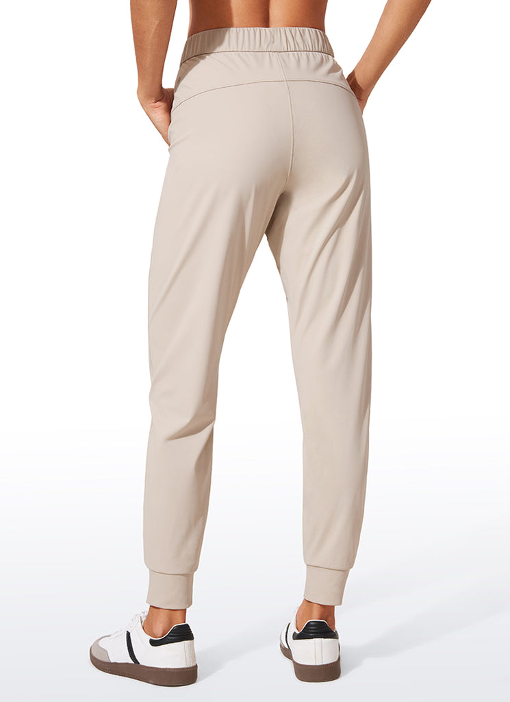 CRZ YOGA Women's Travel Slim Fit Stretch Drawstring Jogger 27'' Dark Lavender Purple