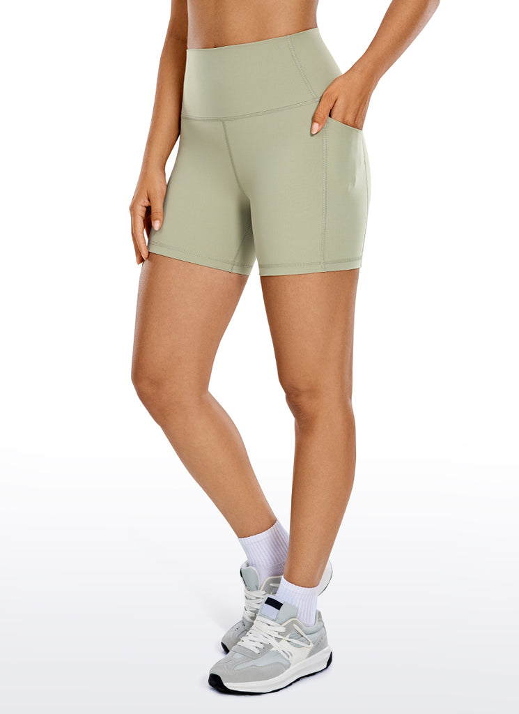 CRZ YOGA Women's Train High Rise Biker Nakedfeel Pocket Shorts 5'' Olive yellow