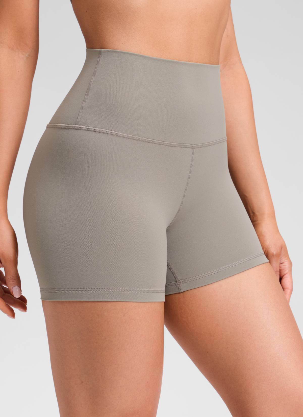 CRZ YOGA Women's Yoga High Rise Biker Shorts Butterluxe Shorts 4'' Warm Ash Grey @model_info:Mariana