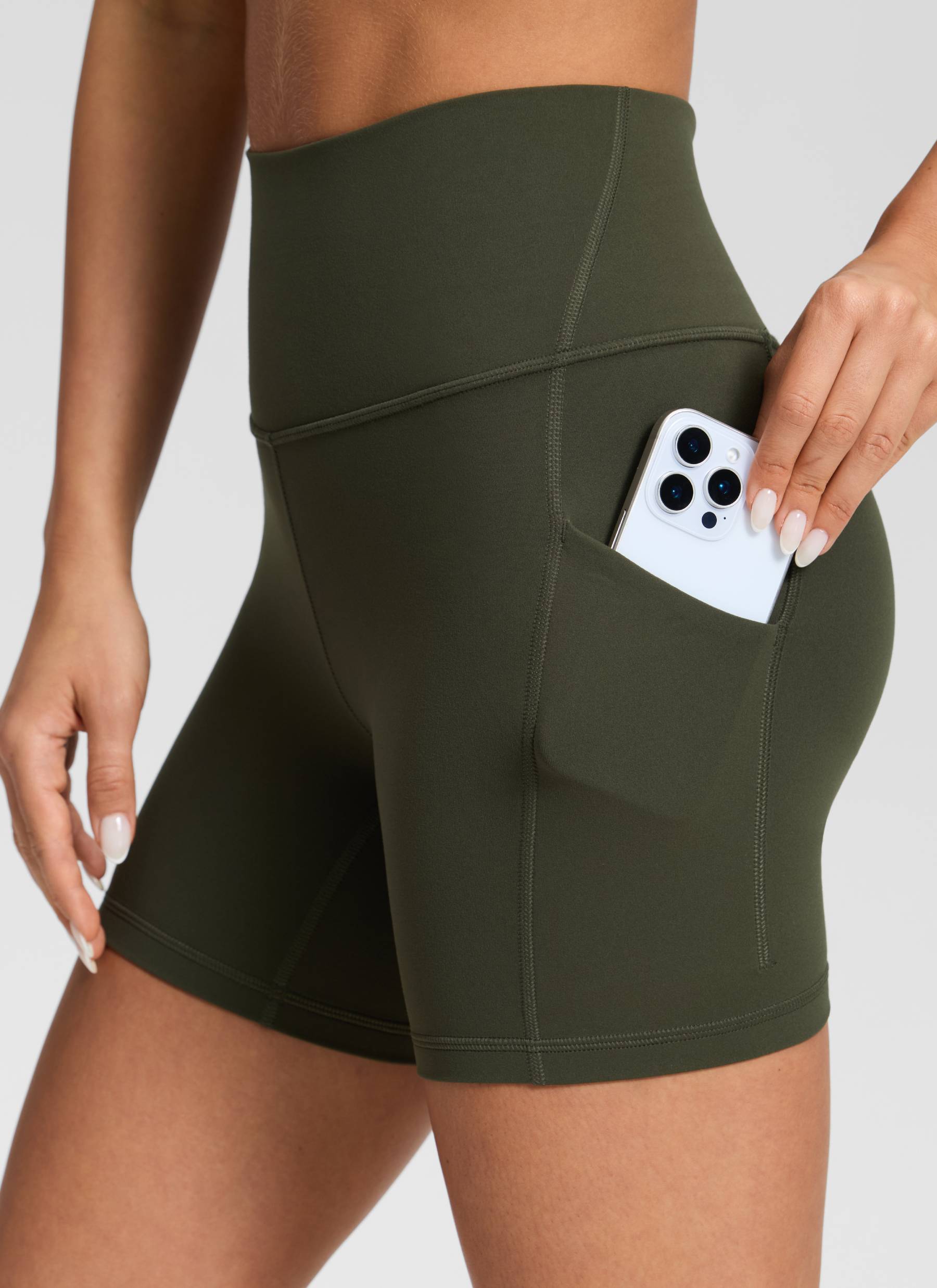 CRZ YOGA Women's Yoga High Rise Biker Butterluxe Pockets Shorts 5'' Olive Green @model_info:Isidora