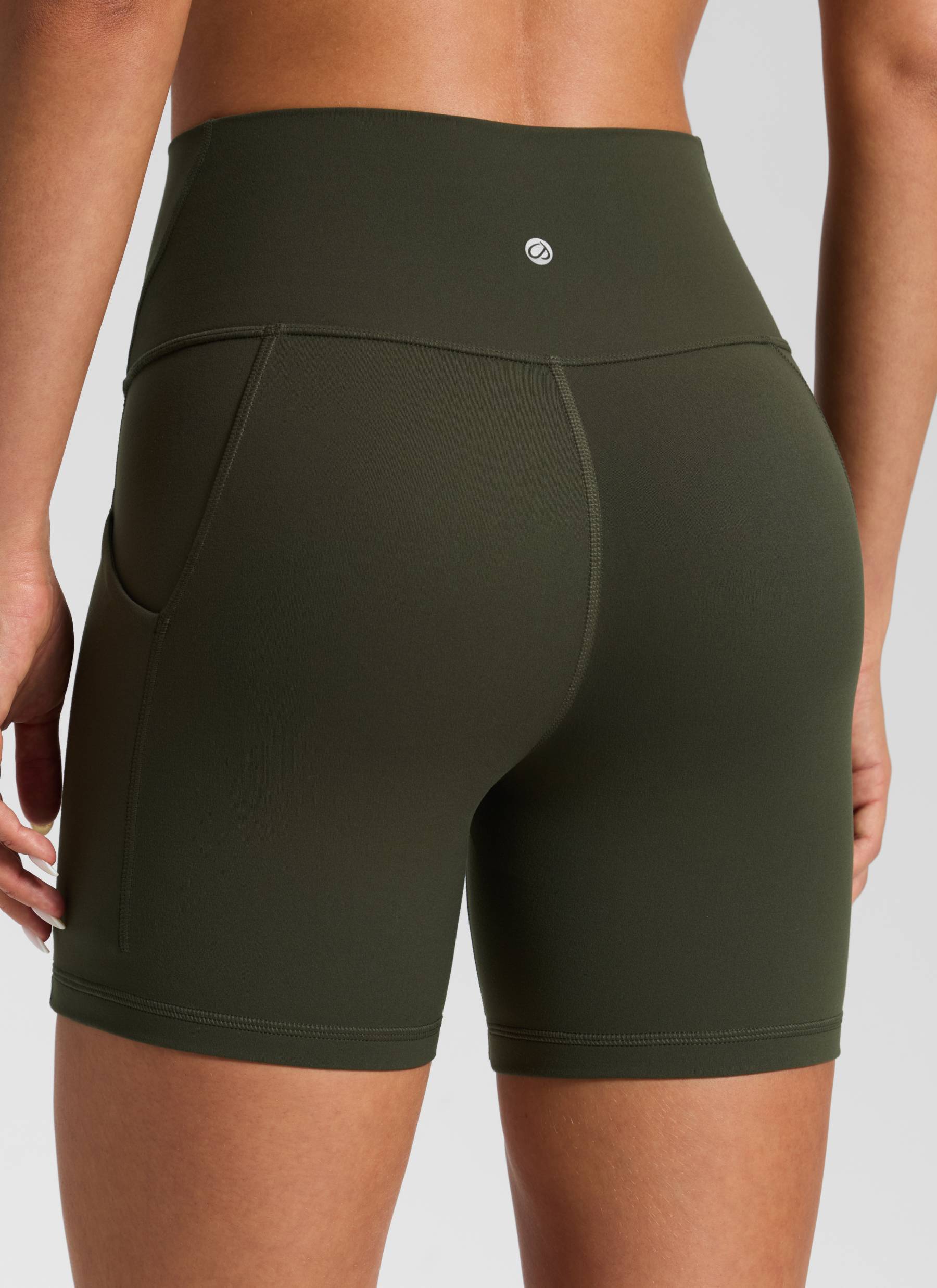 CRZ YOGA Women's Yoga High Rise Biker Butterluxe Pockets Shorts 5'' Olive Green @model_info:Isidora
