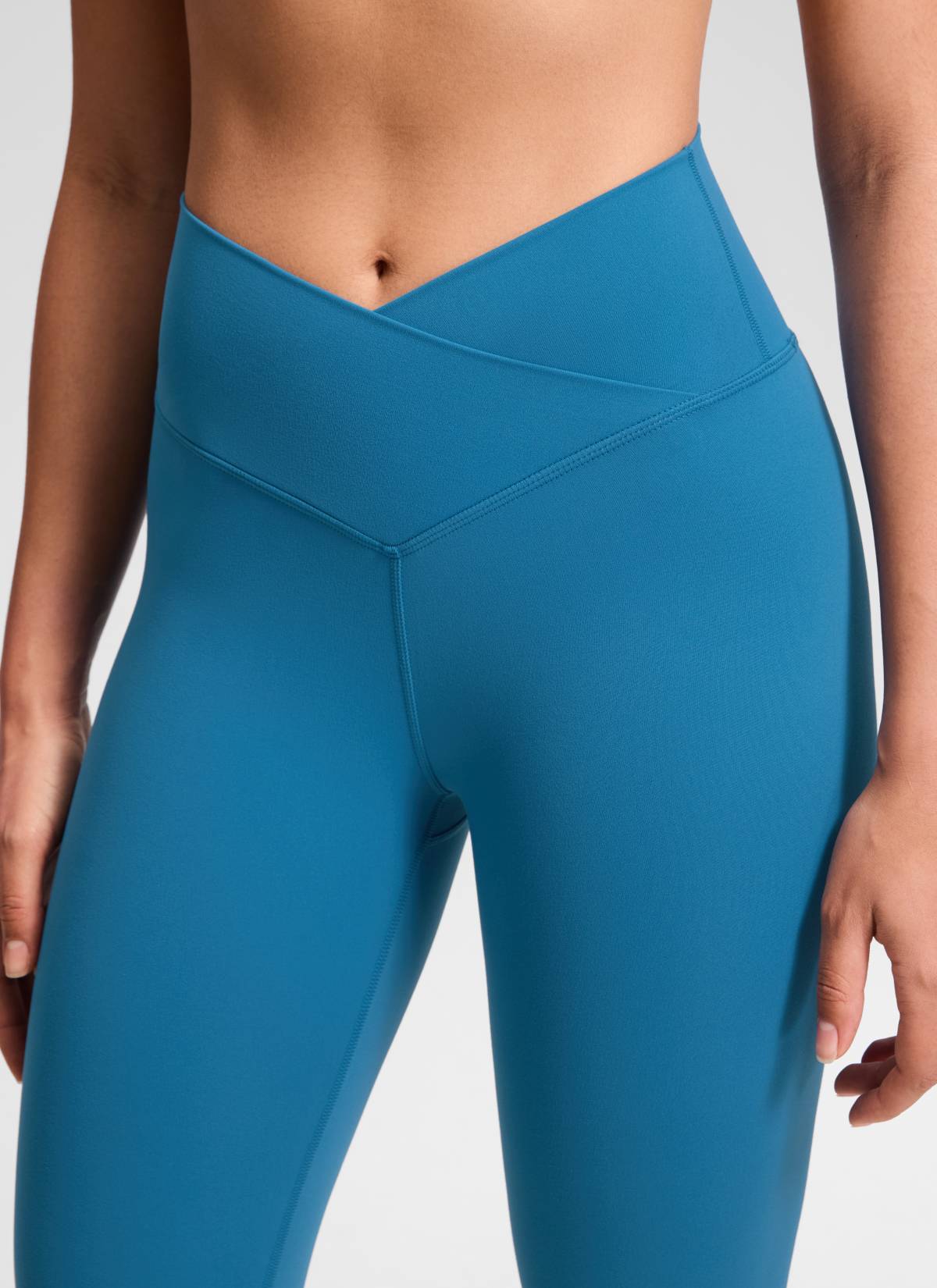 CRZ YOGA Women's High Rise Butterluxe Yoga Leggings 25'' V Cross Waist Super-sonic Blue @model_info:Fiona