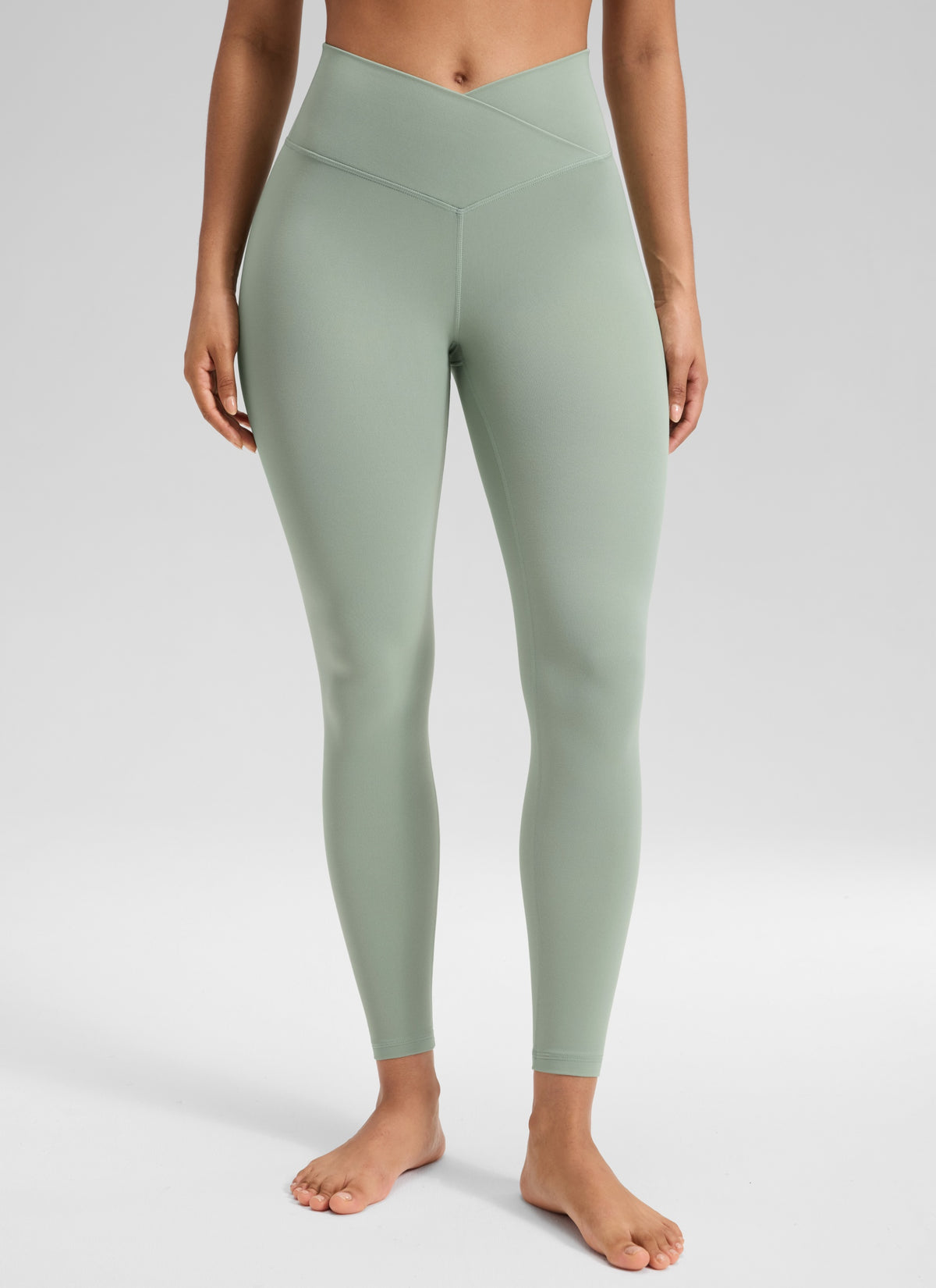 CRZ YOGA Women's High Rise Butterluxe Yoga Leggings 25'' V Cross Waist Green Palm Court @model_info:Carol