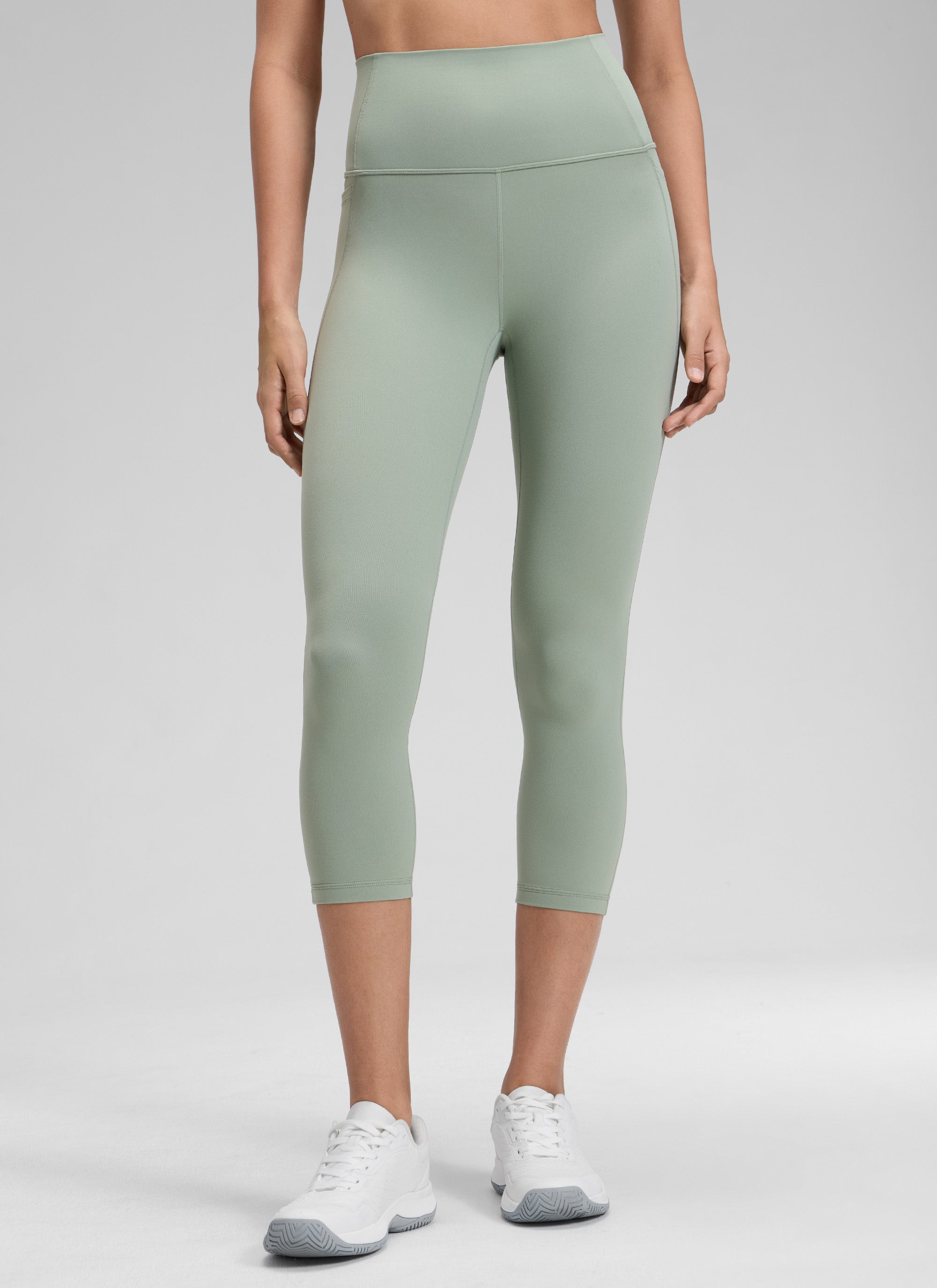 CRZ YOGA Women's Yoga High Rise Butterluxe Capri with Pockets 21'' Green Palm Court @model_info:Jenna