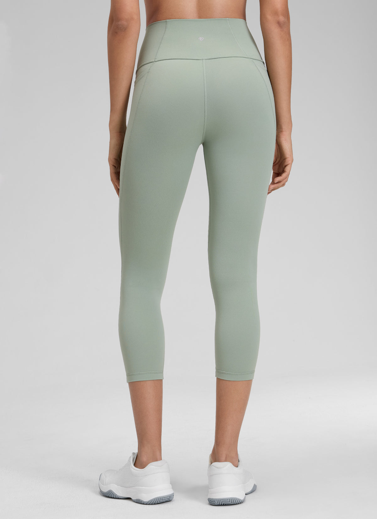 CRZ YOGA Women's Yoga High Rise Butterluxe Capri with Pockets 21'' Green Palm Court @model_info:Jenna