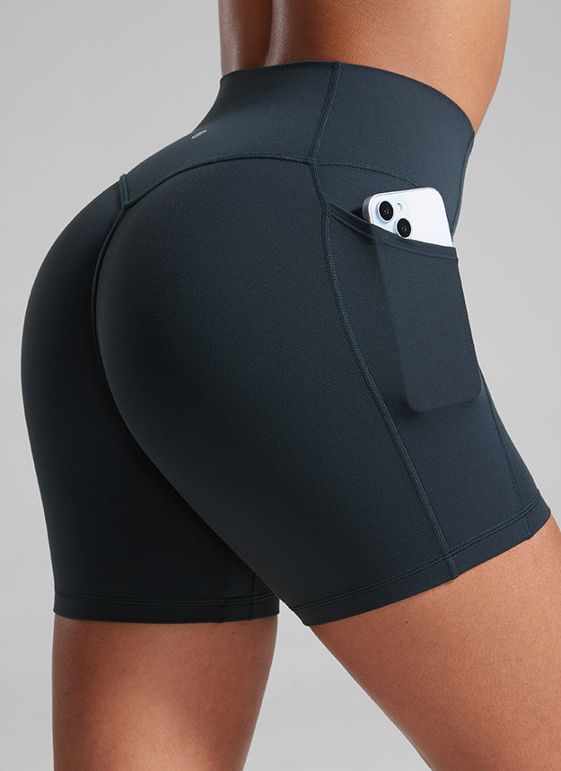 CRZ YOGA Butterlift Womens Scrunch Butt No Front Seam Pocket Biker Shorts 5'' True Navy @model_info:Crystal