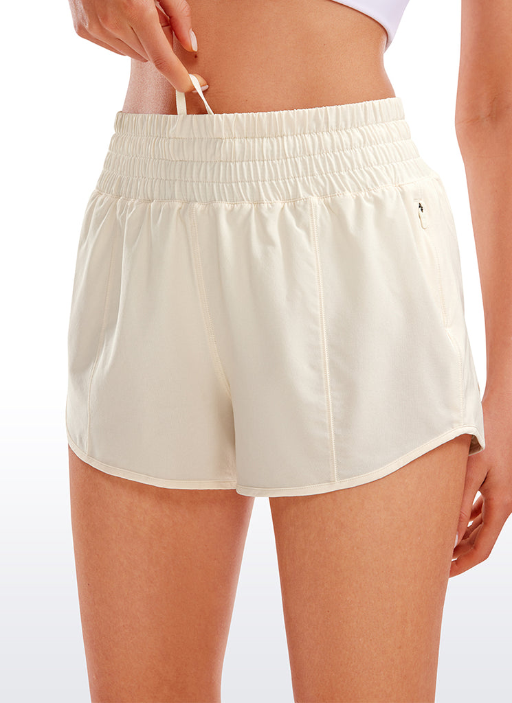 CRZ YOGA Women's Running Feathery-Fit High Rise Lined Shorts 2.5'' White Apricot